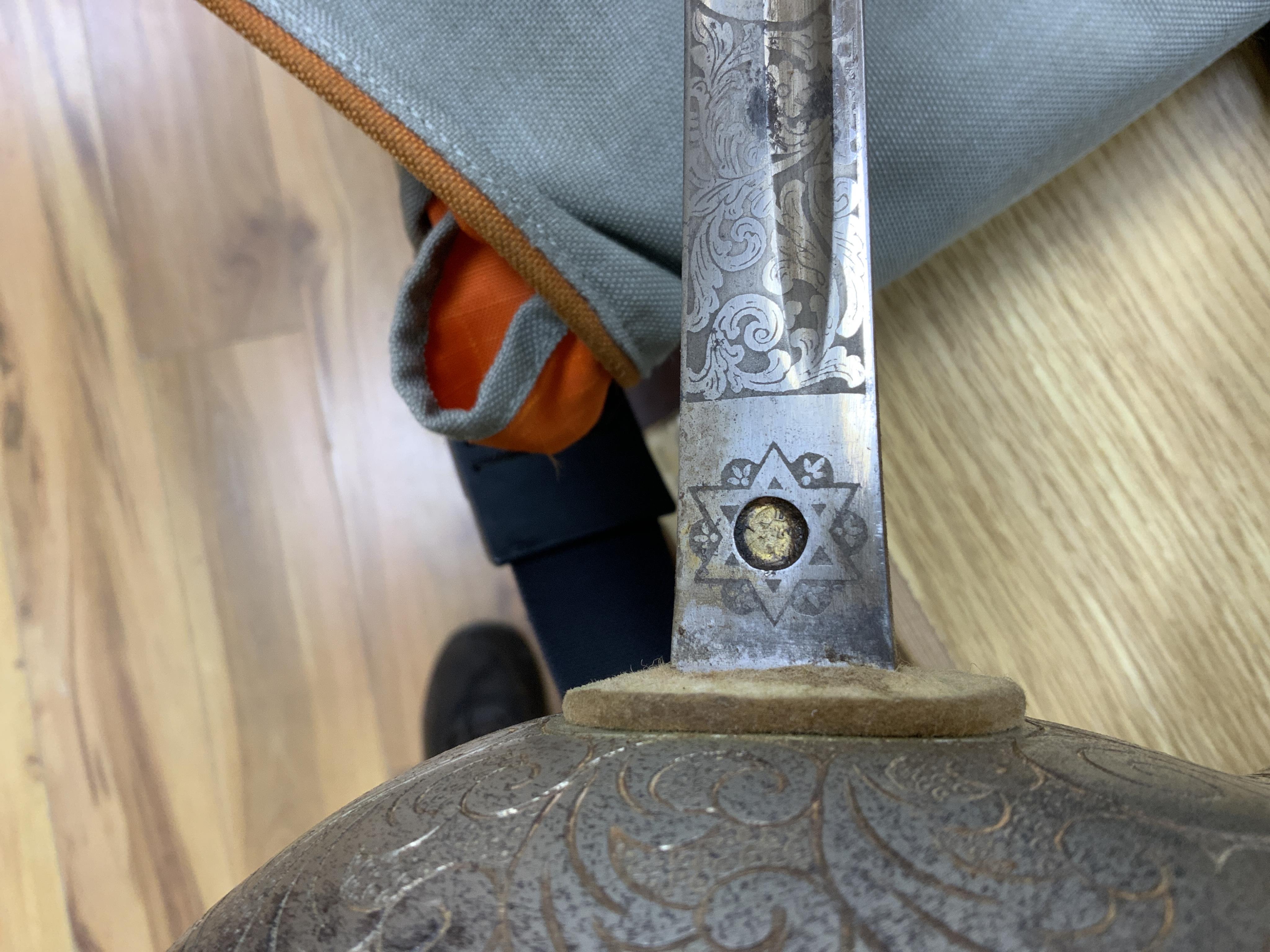 A 1911 pattern cavalry officer’s sword by J. Gaunt and son, etched with crowned GVR cipher and owner’s initials; HPH, regulation hilt and leather covered scabbard